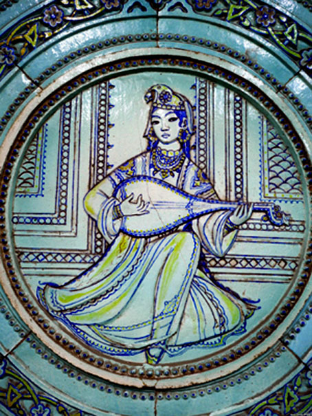 Ceramic panel depicting a woman playing a lute inside Alisher Navoi station.