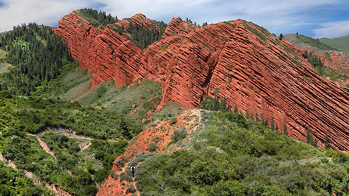 man trekking near Jeti Ögüz rocks, Issyk Kul Region of Kyrgyzstan