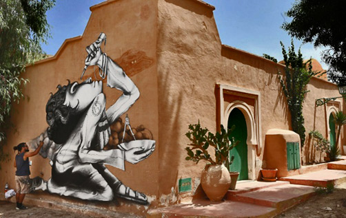 Brazilian-artist-Claudio-Ethos-works-on-his-mural