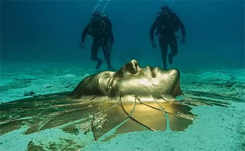 Divers discover ancient solar art head