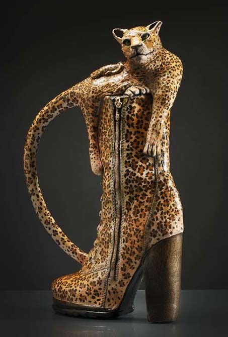 Leopard in a leopard skin boot teapot