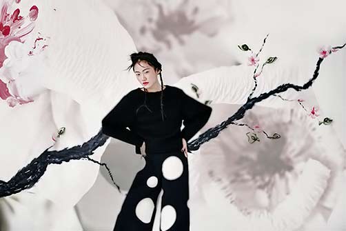 into-bloom-by-hyuna-shin----asian girl in black against a watercolour floral backdrop