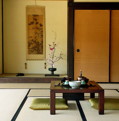 Japanese-Tea-Room with pink blossom ikebana display
