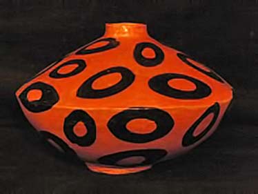 Orange and black Lenca pottery vessel