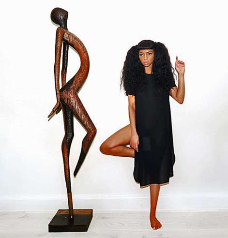 LINA-IRIS-VIKTOR---linairisviktor--standing with an abstract statue