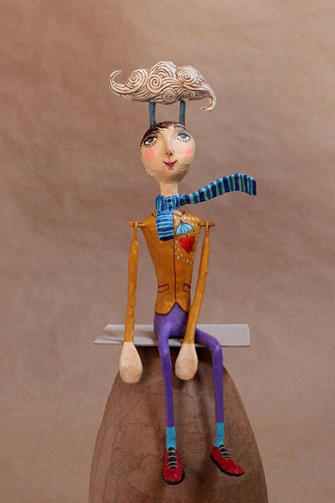 Mauricio Perez--head in clouds paper mache figure