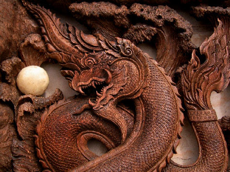 naga sculpture with pearl