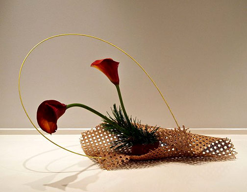 Nordic-Lotus-Modern-basket-ikebana.-Calla-lily,-pine-and-bamboo-stick