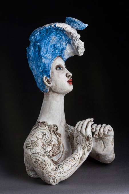 Over-the-edge-2014Amanda-Shelser Bust of a lady with blue hair and tattoos