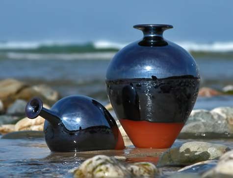 Russell-Akerman-black-bottles at the beach