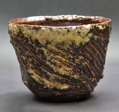 Satoshi-Watanabe-ceramic-tea-bowl with carved texture