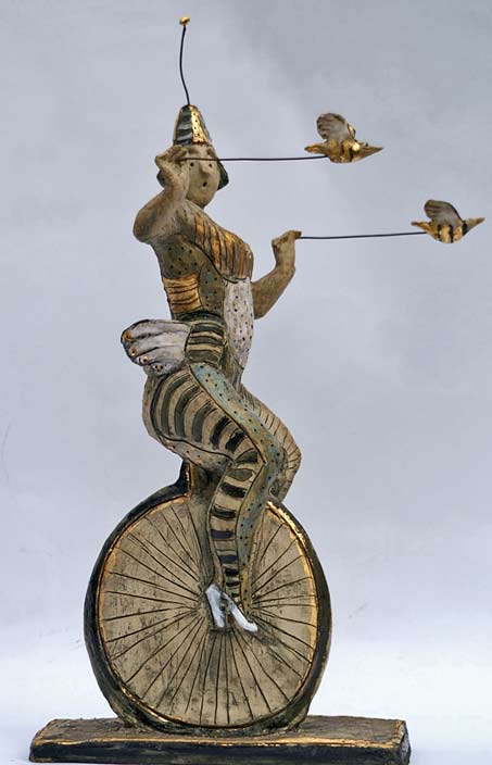 Ceramic-sculpture - Circus performer riding a monocycle by Hermien Buytendijk